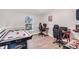 Fun game room with air hockey table, arcade game, and computer station at 1087 Welch Hill Cir, Apopka, FL 32712