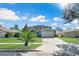 Two-story house with a two-car garage and well-maintained lawn at 1087 Welch Hill Cir, Apopka, FL 32712