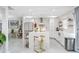 Open concept kitchen boasts white cabinets, a large island, and breakfast bar at 1087 Welch Hill Cir, Apopka, FL 32712