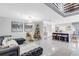 Open concept living room and kitchen with modern sectional sofa and island at 1087 Welch Hill Cir, Apopka, FL 32712