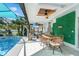 Gorgeous poolside patio with a dining area and plenty of seating at 1087 Welch Hill Cir, Apopka, FL 32712