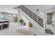 Modern staircase with white risers and black railings, leading to upper level at 1087 Welch Hill Cir, Apopka, FL 32712