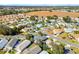 Aerial view showcasing home and surrounding neighborhood landscape at 1201 De La Fuente Ct, The Villages, FL 32162