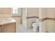 Clean bathroom with tub, toilet, and vanity at 1201 De La Fuente Ct, The Villages, FL 32162