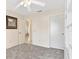 Bedroom with carpet, ceiling fan and built-in shelving at 1201 De La Fuente Ct, The Villages, FL 32162