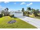 House exterior with driveway and landscaping at 1201 De La Fuente Ct, The Villages, FL 32162