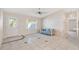 Living room with tile floors and a view to the kitchen at 1201 De La Fuente Ct, The Villages, FL 32162