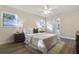 Spacious bedroom with a view and ceiling fan at 130 Frosti Way, Eustis, FL 32726