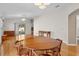 Spacious dining room with hardwood floors and view to kitchen at 1442 Almanza Dr, The Villages, FL 32159