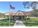 Community building with welcoming entrance and landscaping at 1850 Stacey Dr, Mount Dora, FL 32757