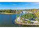 Aerial view of a lakeside town with lighthouse at 1974 Wallingford Loop, Mount Dora, FL 32757