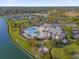 Community clubhouse with pool and lake views at 1974 Wallingford Loop, Mount Dora, FL 32757