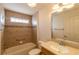 Clean bathroom, featuring a tub, shower, and updated vanity at 1976 Ethanwood Ave, The Villages, FL 32162