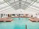 Relaxing indoor pool with a skylight at 26655 Evert St, Leesburg, FL 34748