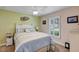 Bright bedroom with a queen-size bed and window shutters at 26934 Camerons Run, Leesburg, FL 34748