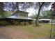 Two-story home with porch and landscaping at 3140 Se 23Rd Pl, Sumterville, FL 33585