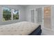 Spacious bedroom with a queen-size bed and access to a private room at 35014 Shady Oaks Ln, Fruitland Park, FL 34731