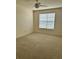 Spacious bedroom with plush carpeting, a ceiling fan, and ample natural light at 420 Summit Ridge Pl # 214, Longwood, FL 32779