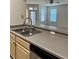 Kitchen with stainless steel sink, faucet, and light wood cabinetry at 420 Summit Ridge Pl # 214, Longwood, FL 32779