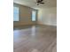Bright, open living room with tile flooring and a ceiling fan at 420 Summit Ridge Pl # 214, Longwood, FL 32779