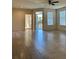 Spacious living room with tile flooring, ceiling fan, and access to a balcony at 420 Summit Ridge Pl # 214, Longwood, FL 32779