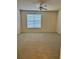Spacious main bedroom with plush carpeting and a large window at 420 Summit Ridge Pl # 214, Longwood, FL 32779