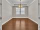 Bright dining room hardwood floors and a chandelier at 4200 Foxhound Dr, Clermont, FL 34711