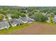 Aerial view of houses and landscape in Kingsbridge at 4351 Hammersmith Dr, Clermont, FL 34711