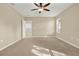 Spacious bedroom with ceiling fan and carpet at 4831 Waters Gate Dr, Tavares, FL 32778