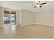 Living room with tile floors and sliding glass doors at 4831 Waters Gate Dr, Tavares, FL 32778