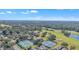 Aerial view of community amenities, including tennis courts at 5060 Greenbriar Trl, Mount Dora, FL 32757