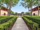 Walkway to inviting community pool area with lush landscaping at 5387 High Park Ln, Orlando, FL 32814