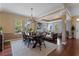 Bright dining room with a large wooden table and chandelier at 5387 High Park Ln, Orlando, FL 32814