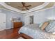 Main bedroom with wood floors, large windows, and dresser at 5387 High Park Ln, Orlando, FL 32814