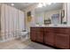 Bathroom features a double vanity and a shower/tub combo at 545 Kistler Cir, Clermont, FL 34715