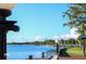 Scenic waterfront view with dock and lampposts at 595 S Morningside Dr, Eustis, FL 32726