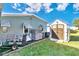 Backyard view showing a shed, AC unit, and small cart at 6624 Westchester Ne Dr, Winter Haven, FL 33881