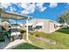 Exterior view of the house, carport, and golf cart at 6624 Westchester Ne Dr, Winter Haven, FL 33881