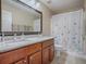 Bathroom with double vanity and granite countertops at 7537 Lake Andrea Cir, Mount Dora, FL 32757