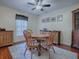 Quaint dining room with hardwood floors and wooden furniture at 7537 Lake Andrea Cir, Mount Dora, FL 32757