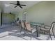 Covered patio with table and chairs, great for outdoor dining at 7537 Lake Andrea Cir, Mount Dora, FL 32757