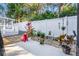 Landscaped backyard with patio and various plants at 9033 Saint Andrews Way, Mount Dora, FL 32757