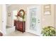 Bright and spacious entryway with a decorative console table and mirror at 973 Belle Oak Dr, Leesburg, FL 34748