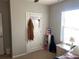 Bright bedroom with window, closet, and neutral walls at 9785 Pepper Tree Trl, Wildwood, FL 34785