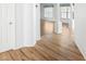 Hallway view of living room with wood floors at 1003 Mi Tierra Way, The Villages, FL 32159