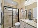 Clean bathroom with granite countertop and walk-in shower at 11030 Se 169Th Ln, Summerfield, FL 34491