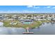 Community overview with lakefront clubhouse and pool at 1435 Mohawk Cir, Tavares, FL 32778