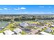 Aerial view of community clubhouse, pool, and lakefront at 1435 Mohawk Cir, Tavares, FL 32778