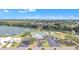 Community clubhouse and pool with lake view at 1435 Mohawk Cir, Tavares, FL 32778