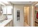 Clean bathroom with vanity, linen closet and toilet at 1435 Mohawk Cir, Tavares, FL 32778